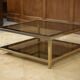 Hollywood Regency coffee table in smoked glass with mirrored framing from the 1970s.