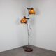 Vintage Hungarian adjustable floor lamp with two orange globe shades, circa 1970.