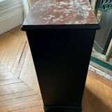 Wooden chest of drawers with red marble top
