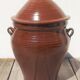 Large glazed terracotta jar, cognac colour with its lid.
