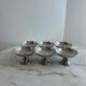 Set of 6 stainless steel dessert bowls on a stand.