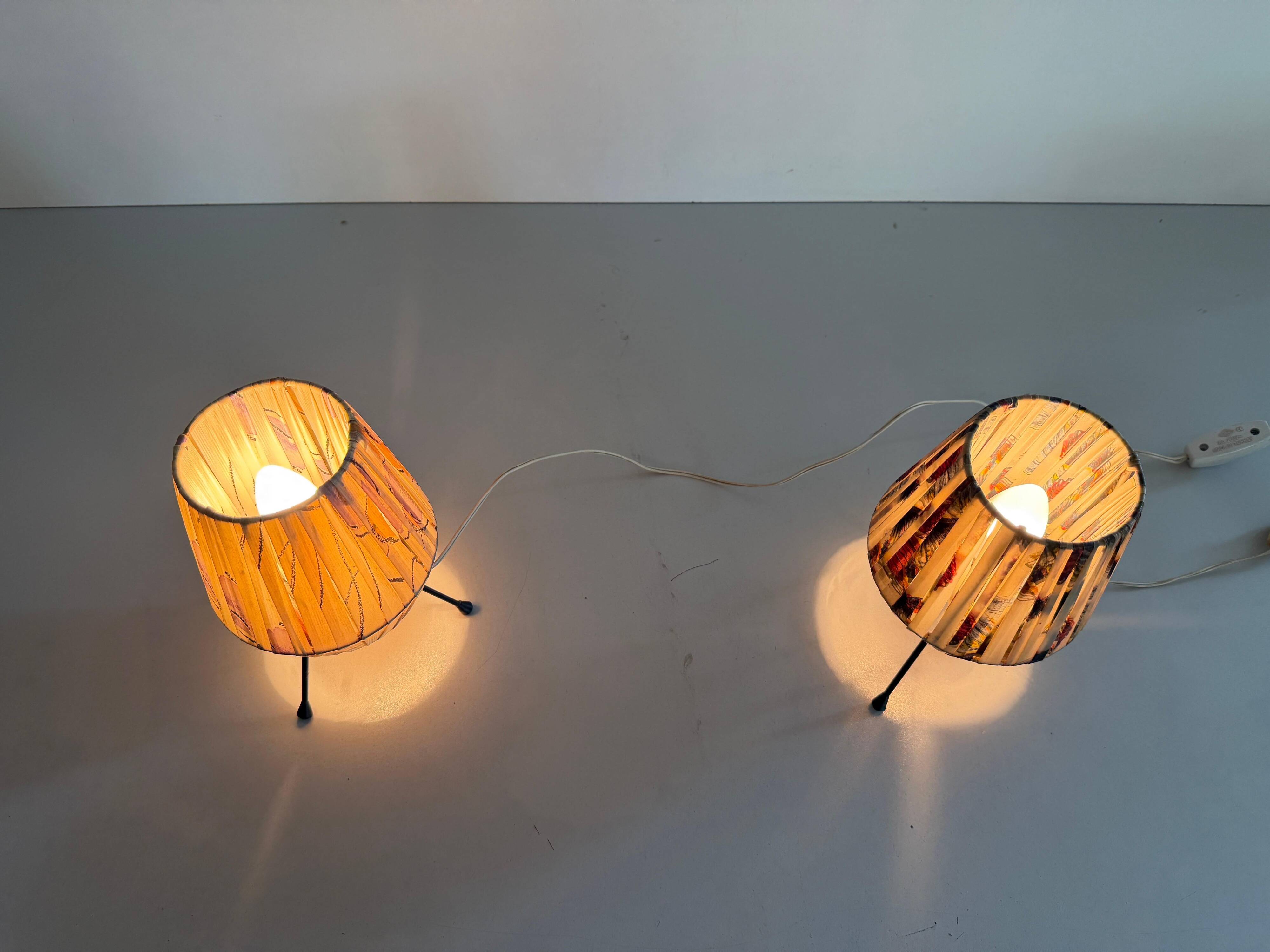 Pair of table lamps with plastic shades and tripod base, 1960s, Italy