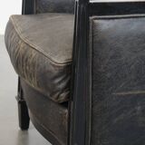 Black Art Deco design cow leather and wooden armchair with loose cushion