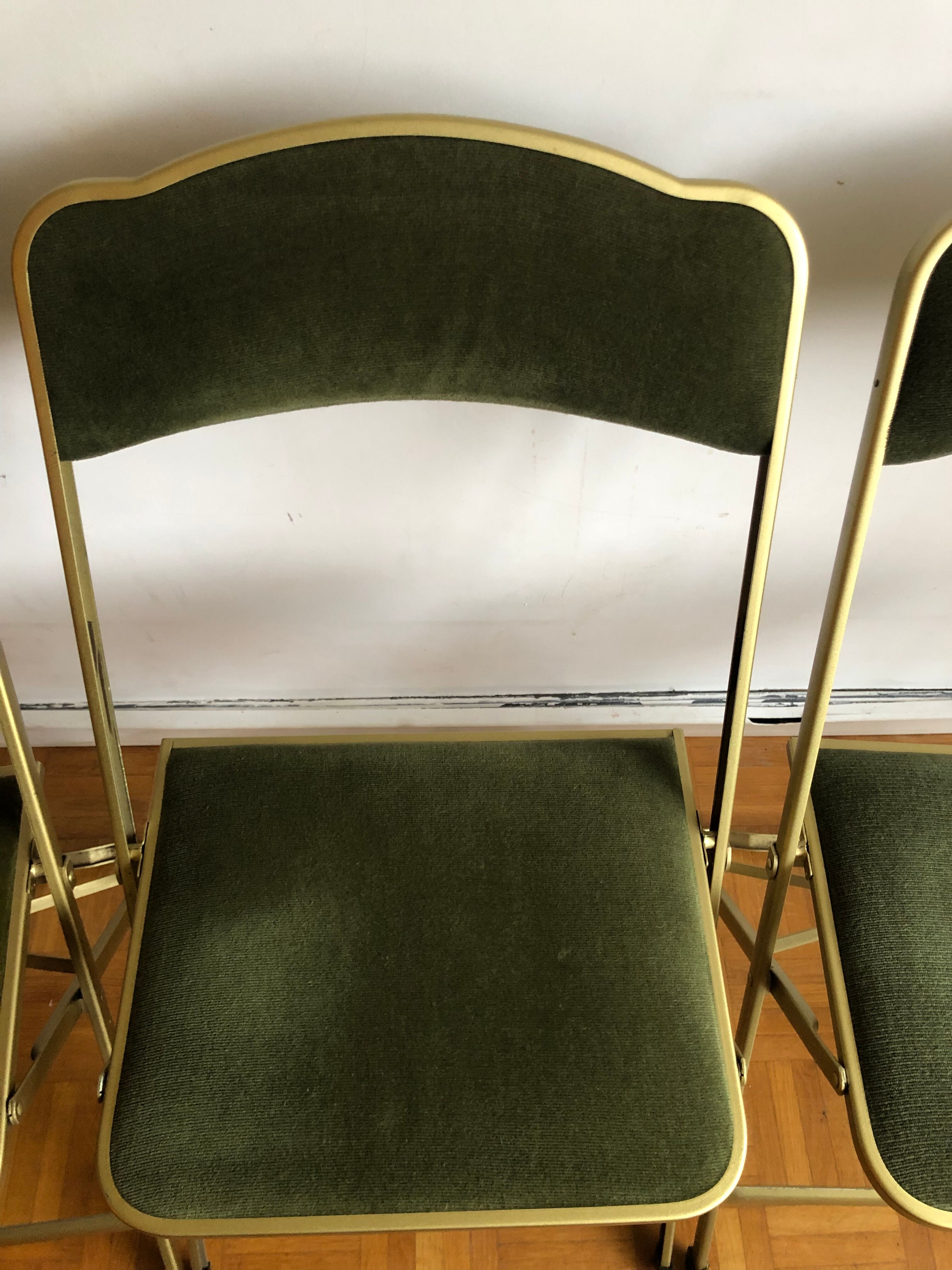Set of three vintage green folding chairs