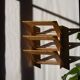 Wall-mounted magazine rack in varnished plywood, 80s/90s