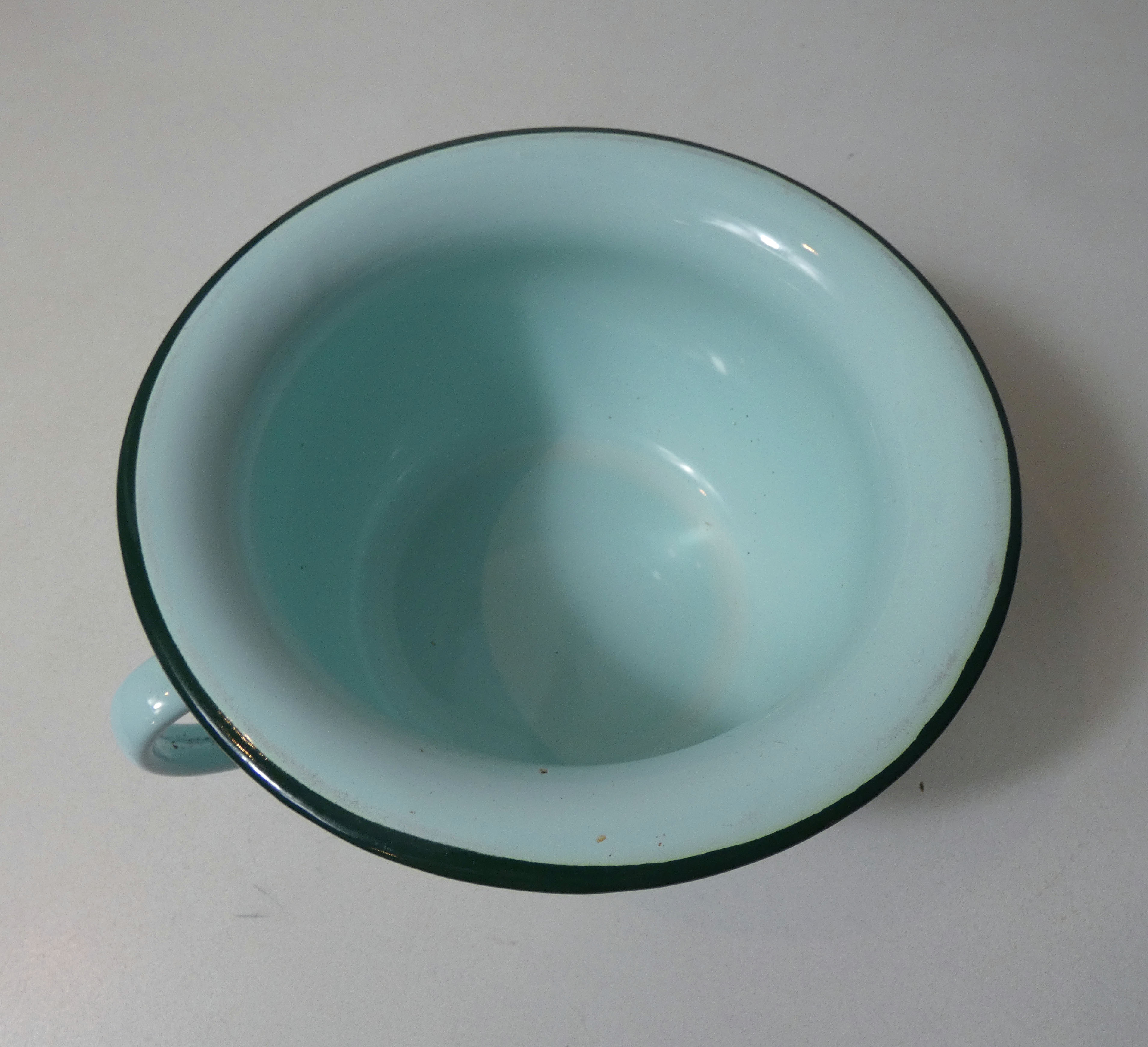 Old green enamelled steel pot cover