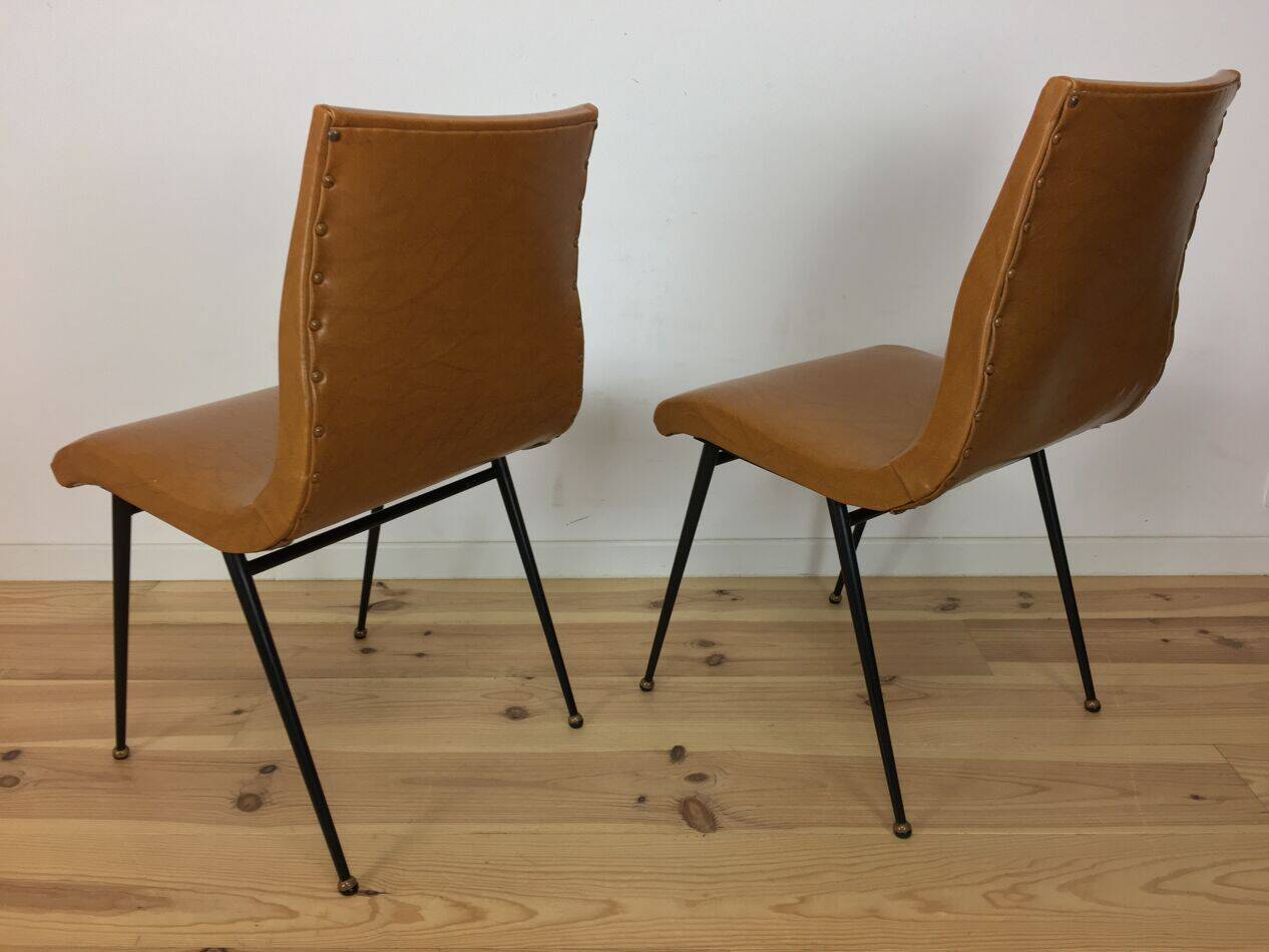 Pair of 1950s chairs with compass legs and brown faux leather.