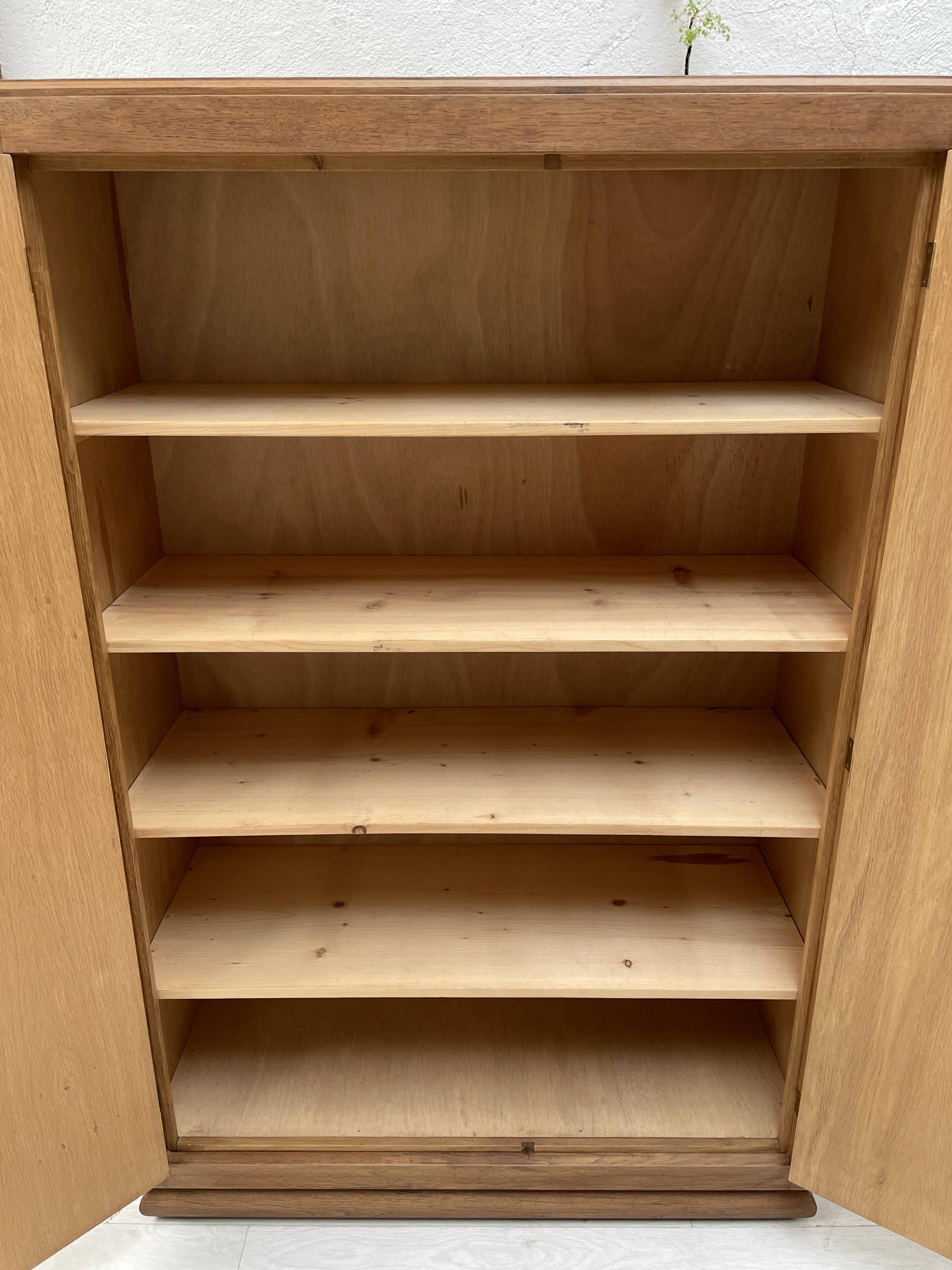 Storage unit in solid oak and veneer, circa 1960.