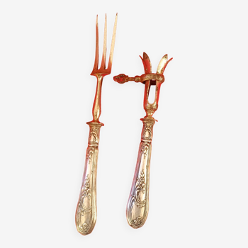 Pair of cutlery for serving lamb.
