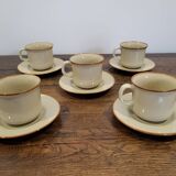5 enameled stoneware cups and saucers