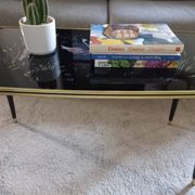 Vintage coffee table with tapered legs.