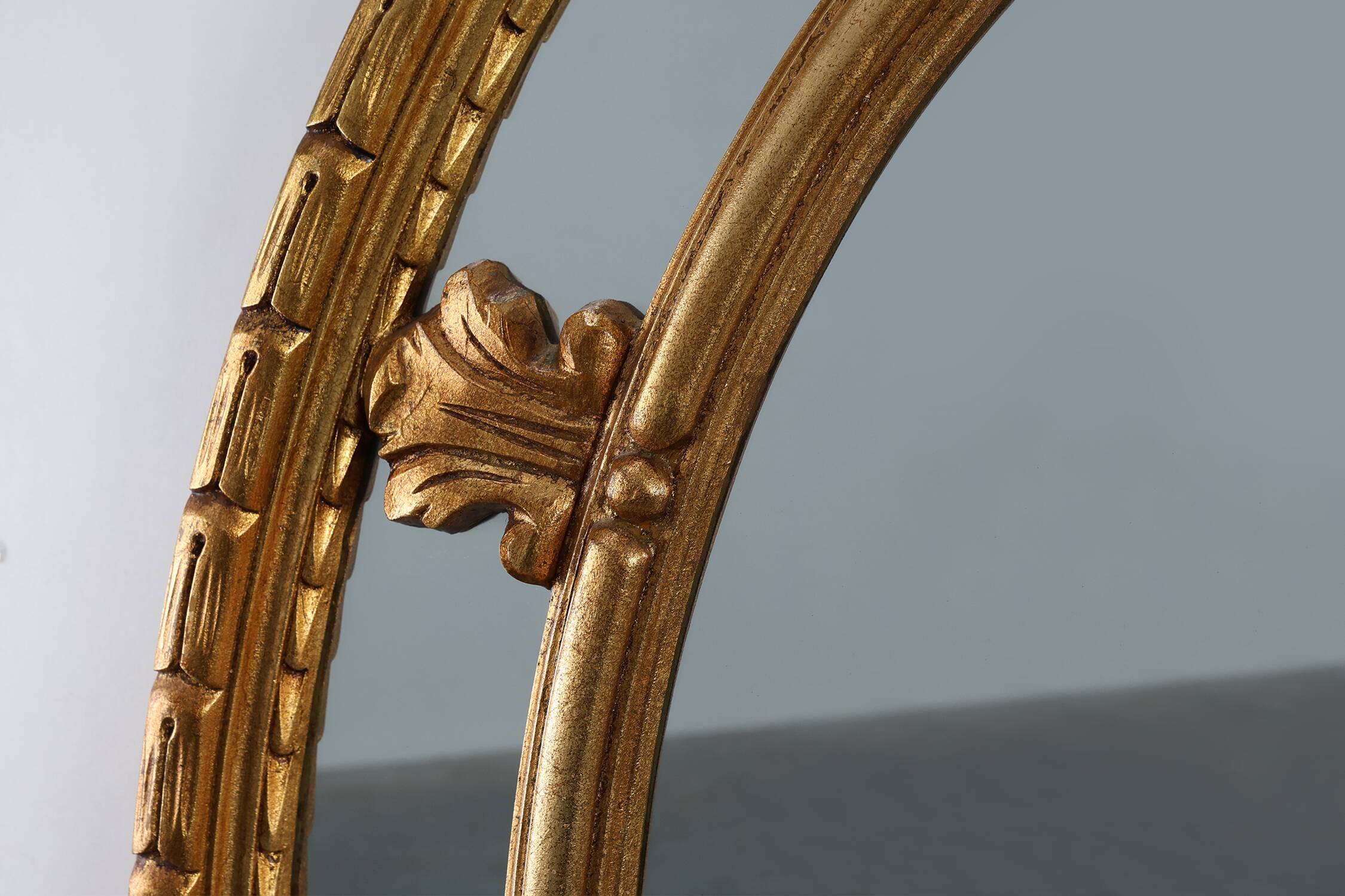 20th century neo-classical style tilted oval mirror by Deknudt, Belgium