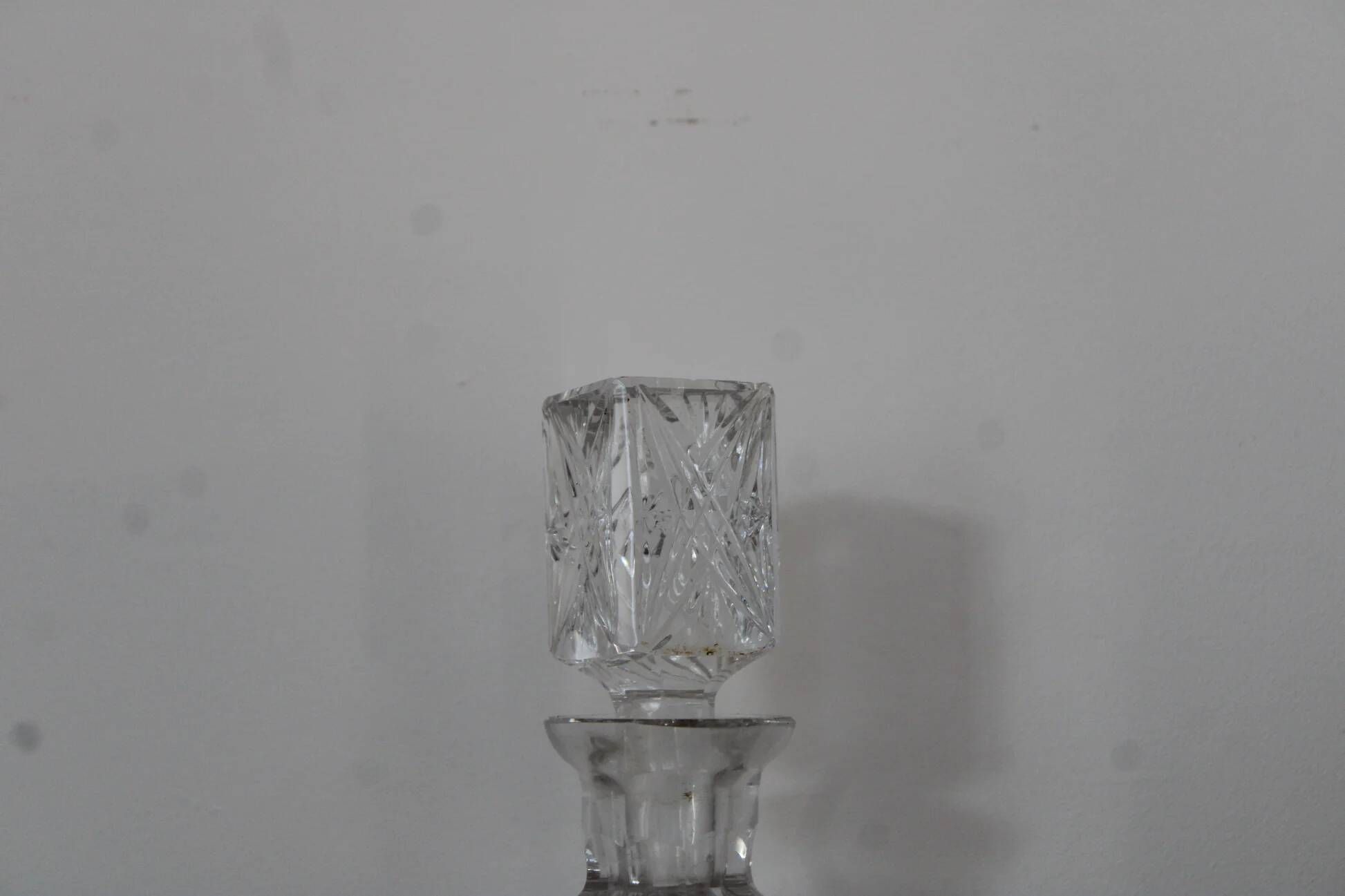 Antique cut glass carafe, probably crystal – Geometric patterns and matching stopper.