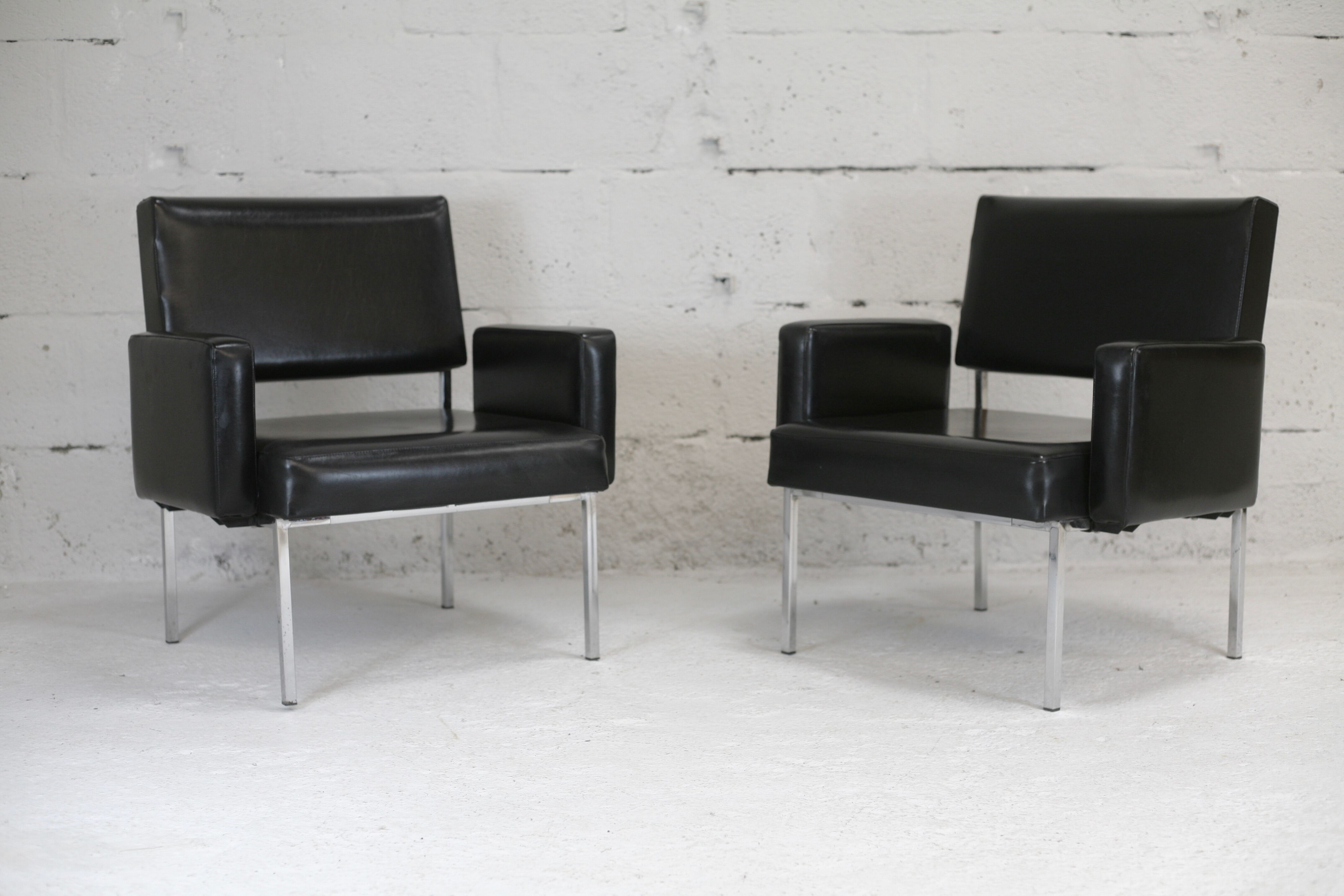 Pair of stainless steel, black leather-like armchairs, France, circa 1970