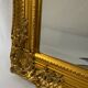 Miroir biseauté style empire doré 64x54cm