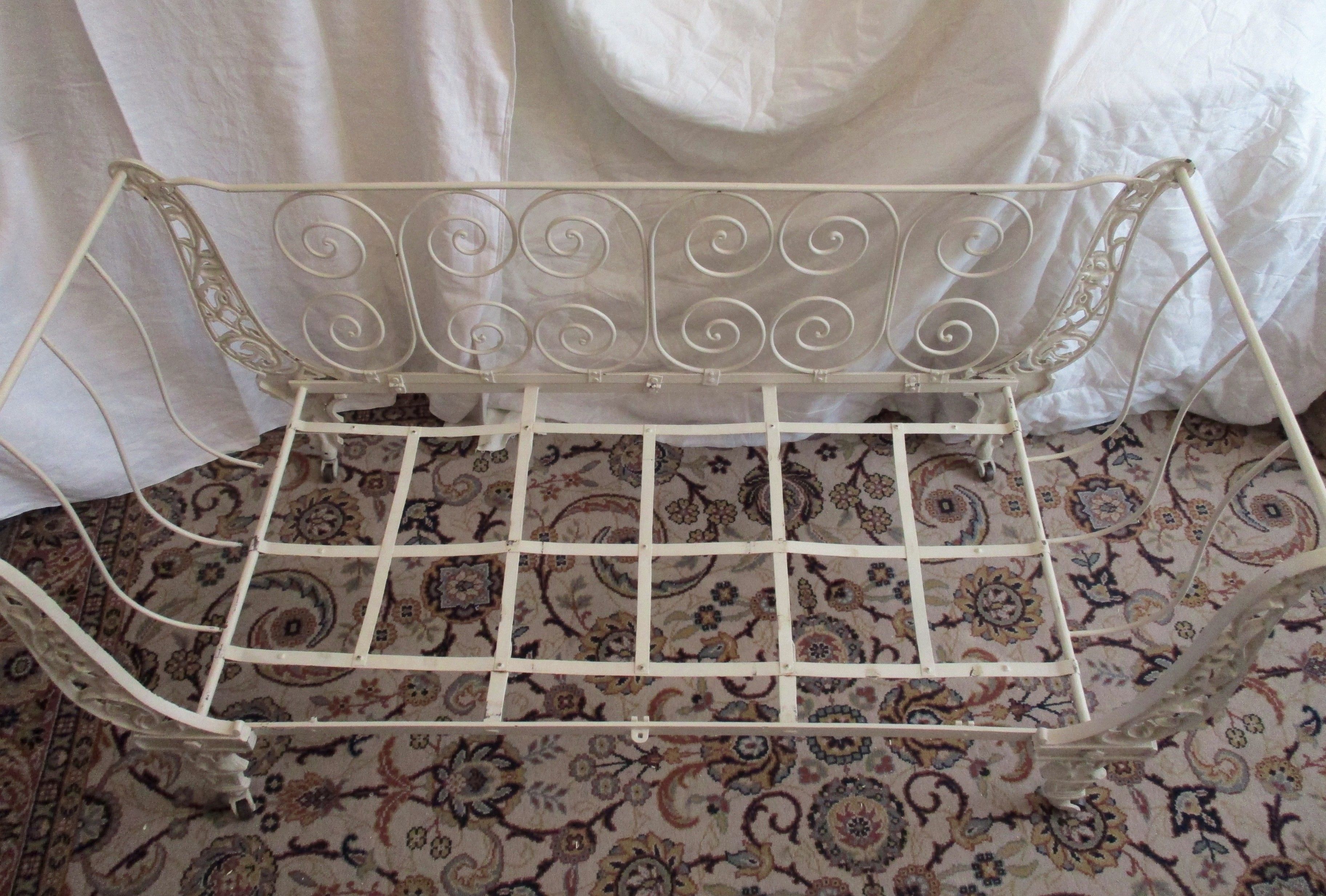 Cast iron and iron children's bed at the end of the 19th century