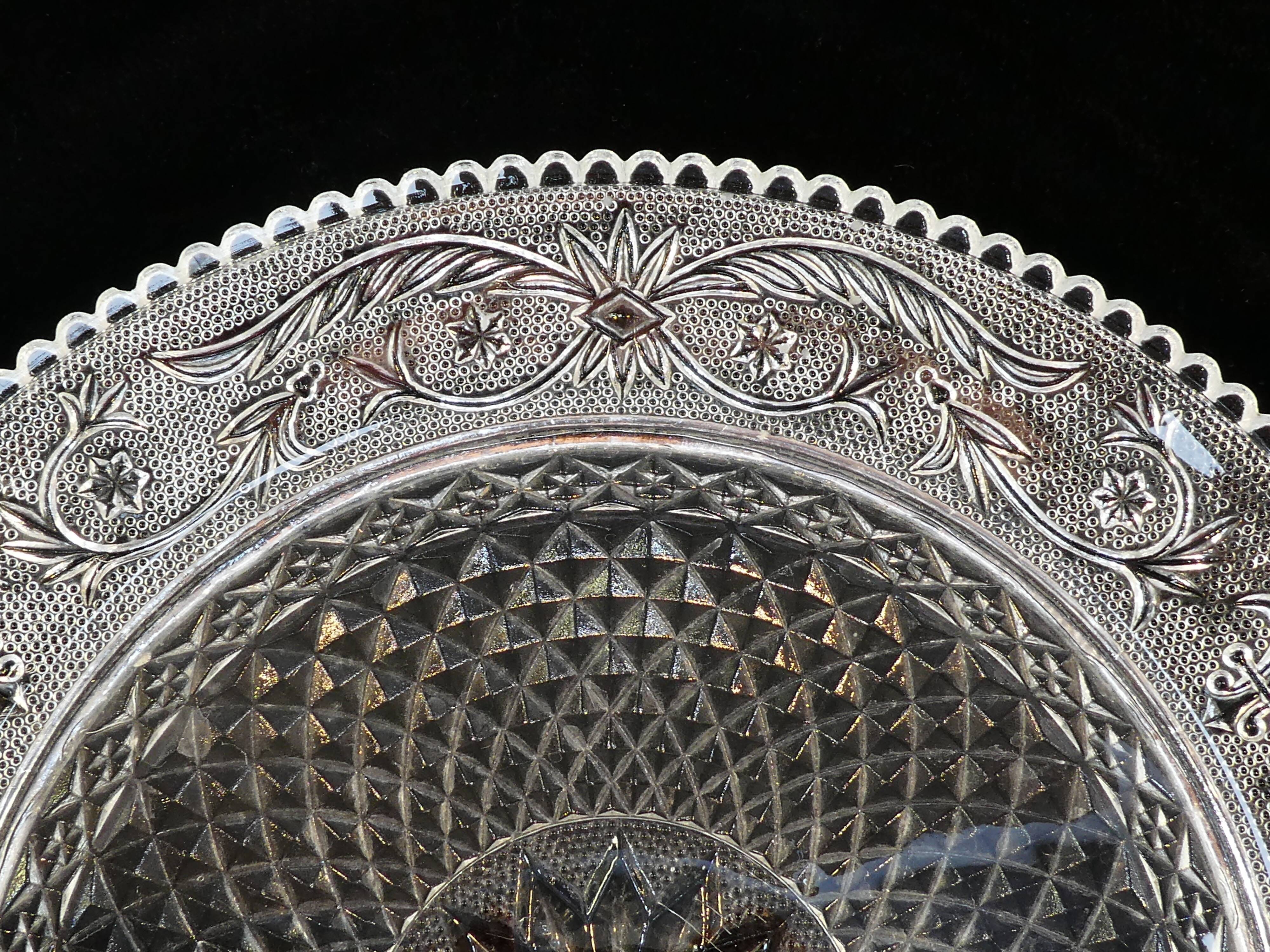 Old plate with pressed glass arabesque pie