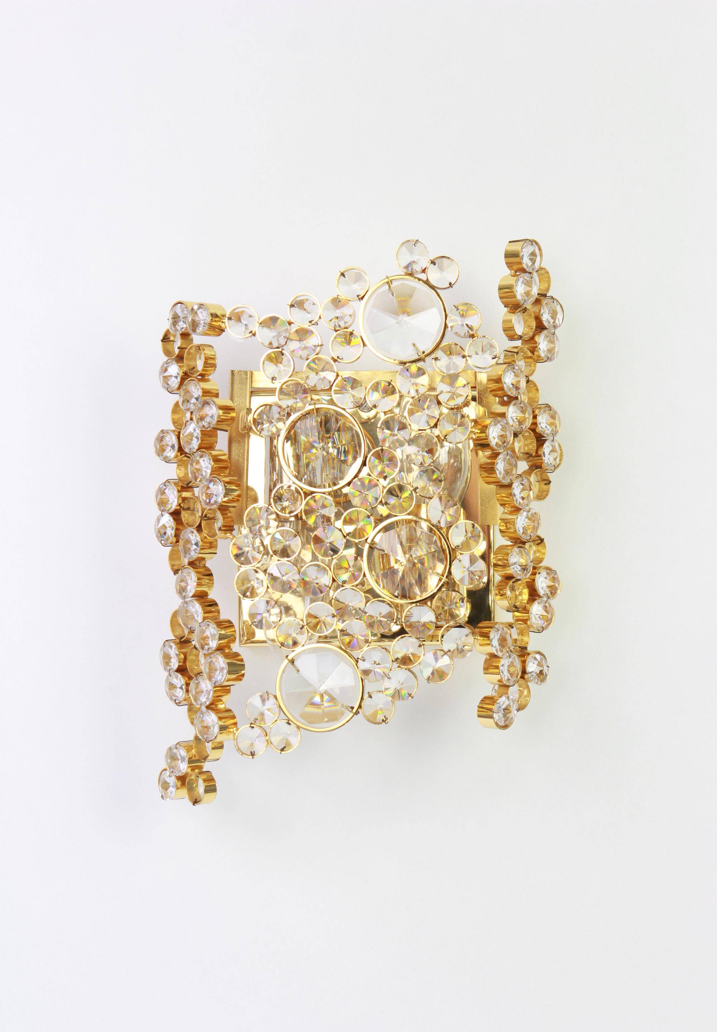 Pair of wall sconces in gilded brass and crystal by Palwa, Germany, 1960s.