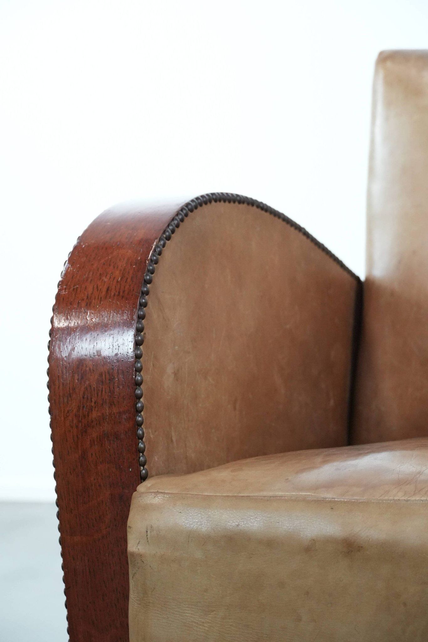 Art Deco design armchair in light cognac cowhide leather.