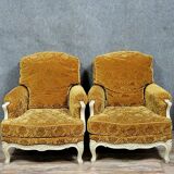 Pair of Louis XV style Bérgères in lacquered wood, 19th century