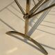Brass and wood magazine rack, in the style of Cesare Lacca.