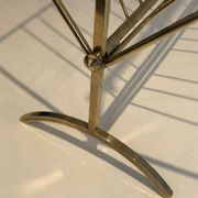Brass and wood magazine rack, in the style of Cesare Lacca.