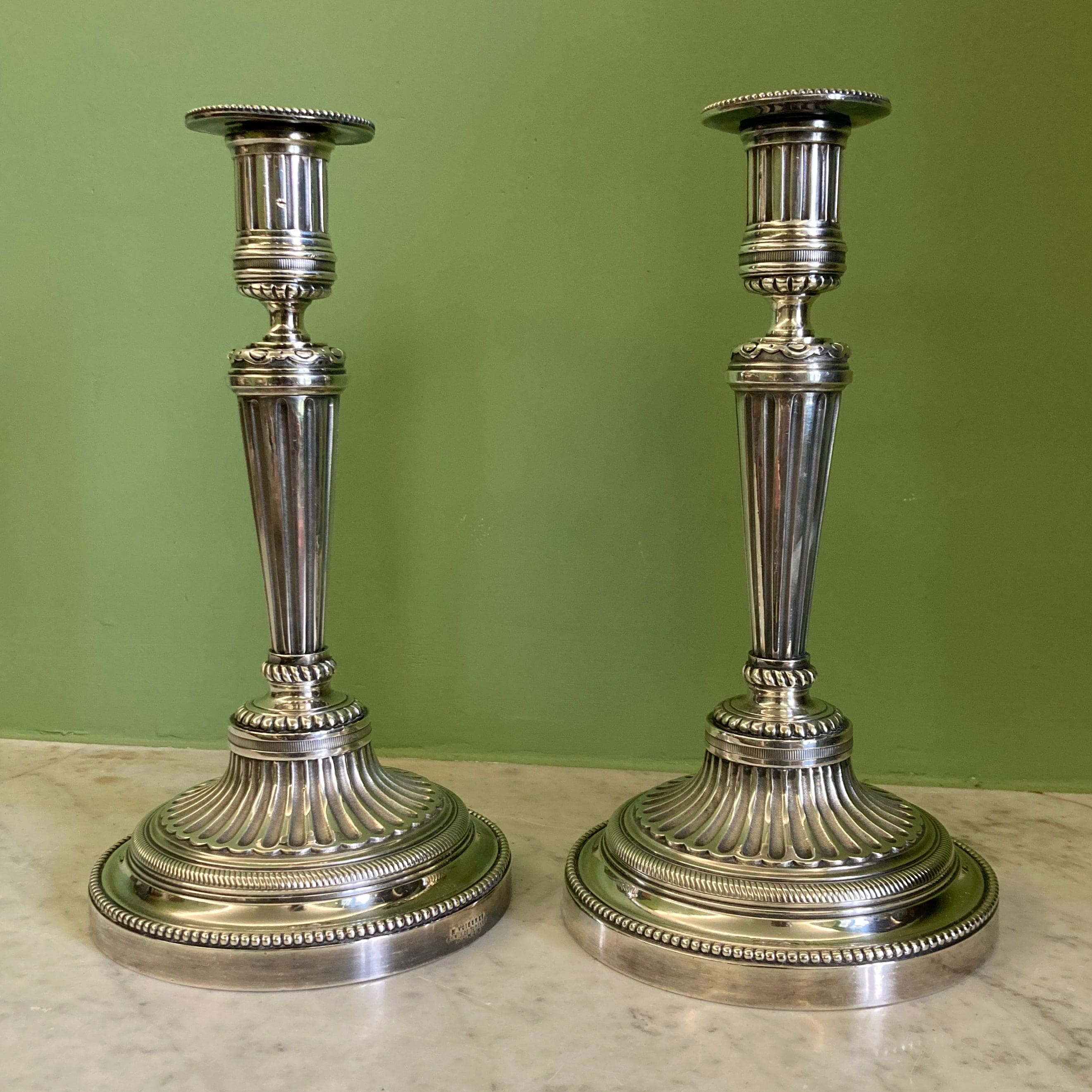 Pair of silvered bronze candlesticks from the 19th century in Louis XVI style signed Voisenet.