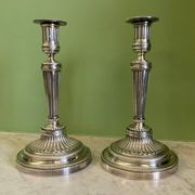 Pair of silvered bronze candlesticks in the Louis XVI style signed Voisenet, 19th century.