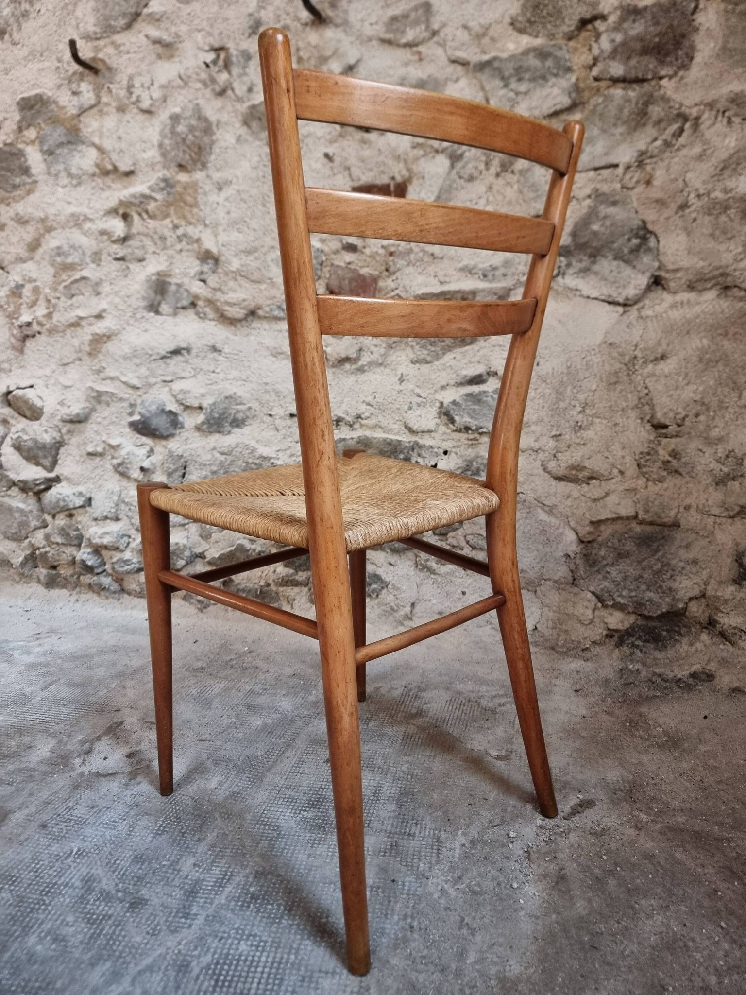 Set of 4 mid-century Italian dining chairs with woven seats, circa 1950–1970.