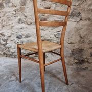 Set of 4 mid-century Italian dining chairs with woven seats, circa 1950–1970.