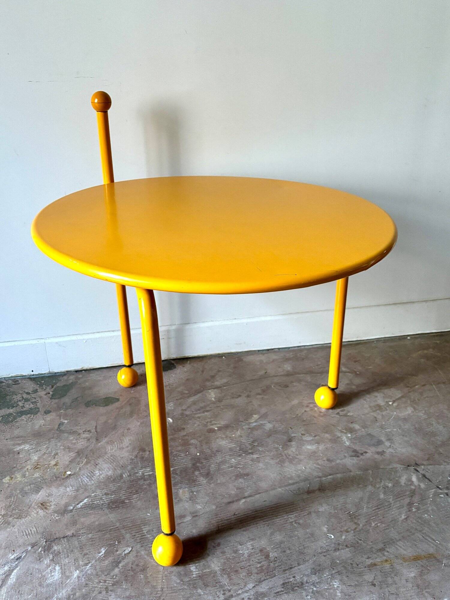 Yellow metal tripod coffee table by Tord Bjorklund for Ikea, circa 1980