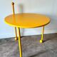 Yellow metal tripod coffee table by Tord Bjorklund for Ikea, circa 1980