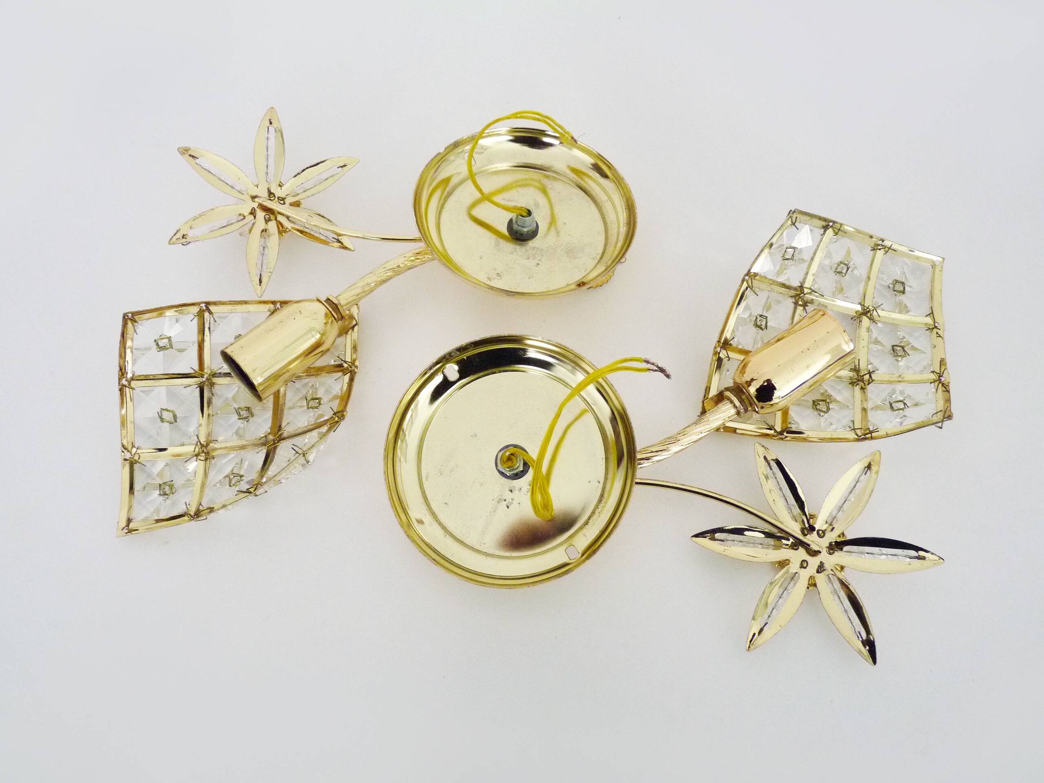 Pair of vintage floral wall sconces in gold metal and tassel