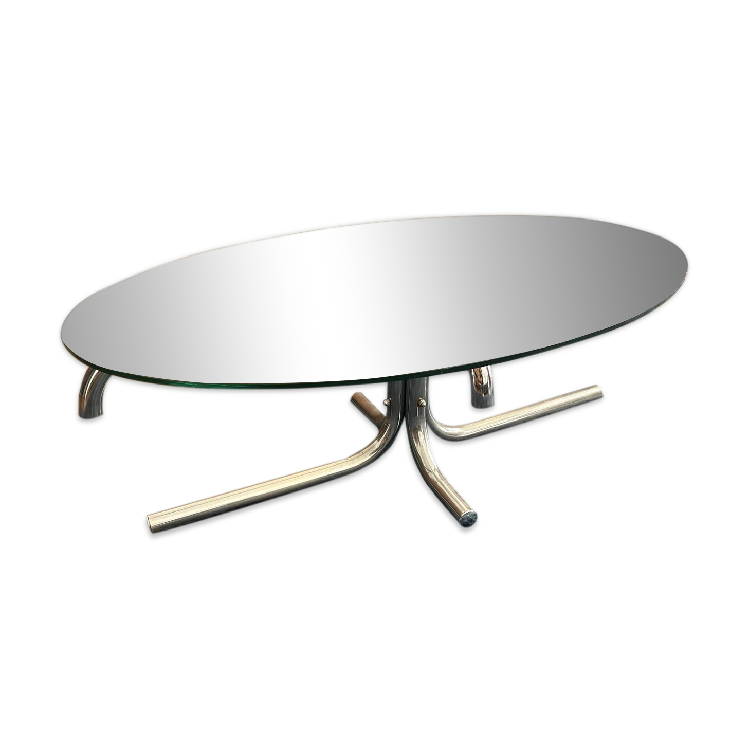 Oval glass coffee table with chrome legs, vintage 70s design.