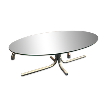 Oval glass coffee table with chrome legs, vintage 70s design.