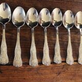A set of 7 large metal shell spoons
