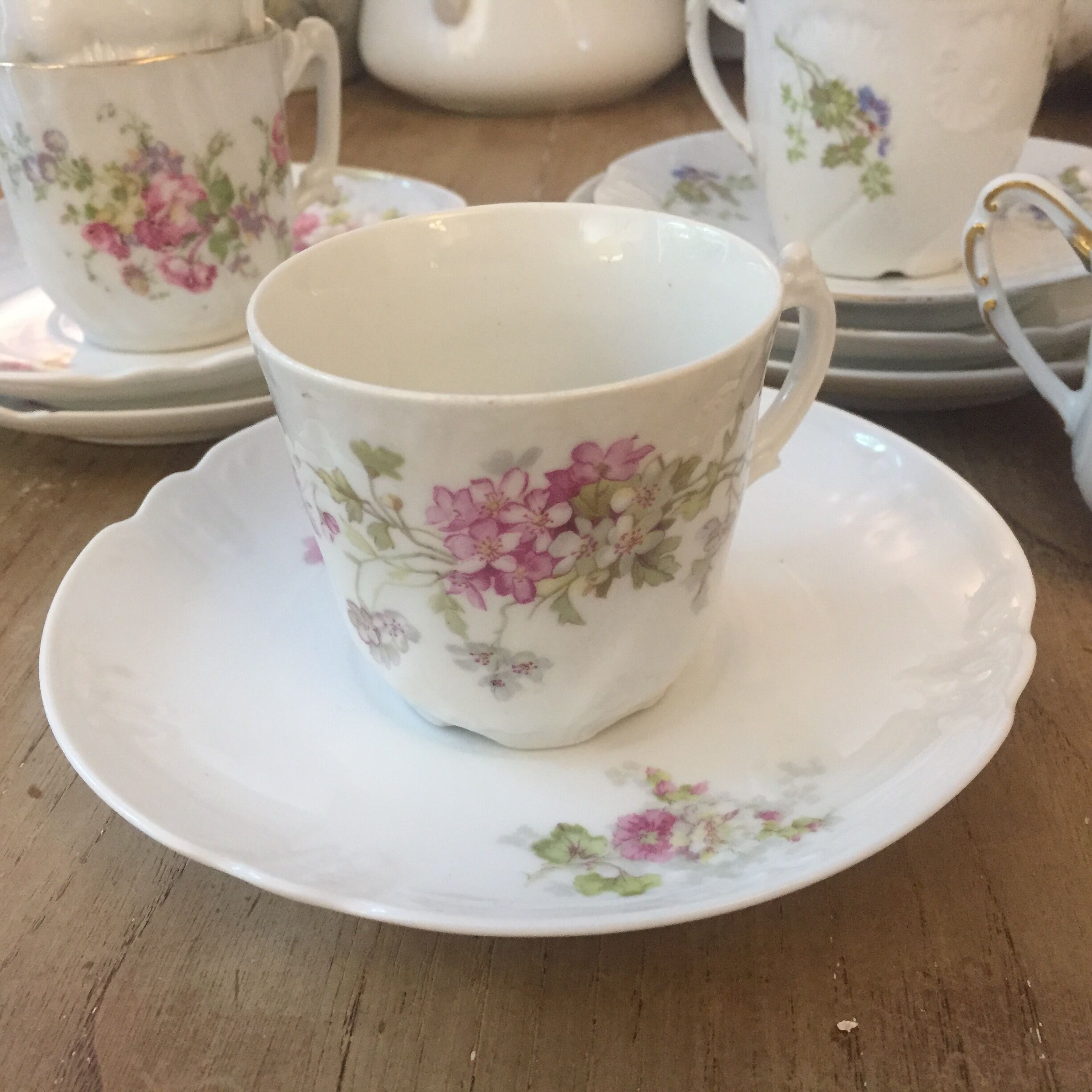 6 antique cups and mismatched saucers