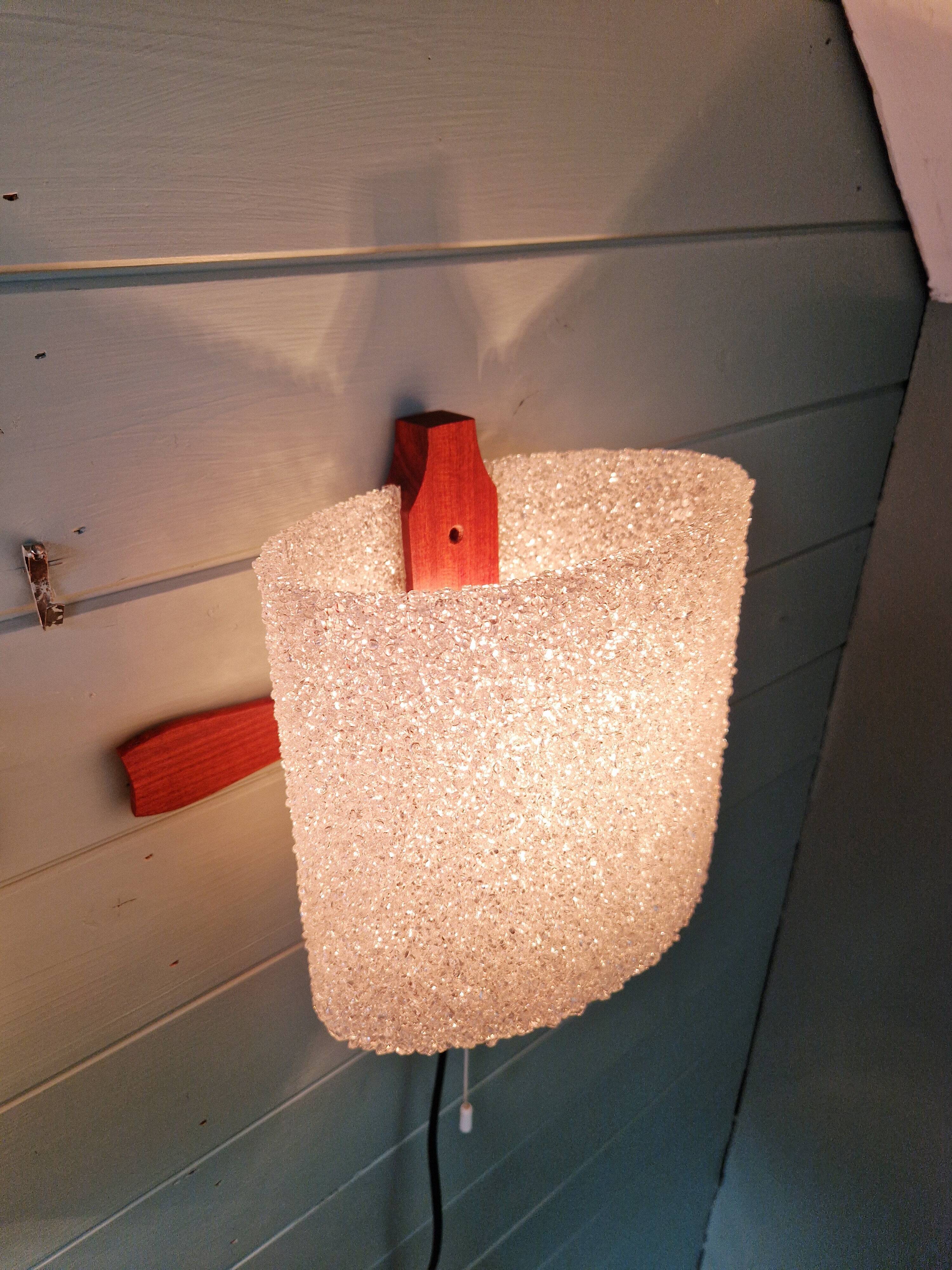 Pair of Scandinavian wall sconces in teak and plastic resin, 1960.