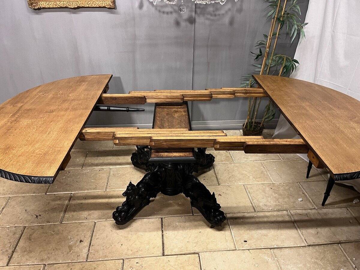 Large oval oak hunting table with central leg and extensions