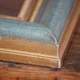 Frame in gilded and green wood