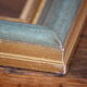 Frame in gilded and green wood