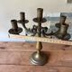 Pair of large 5-light candlesticks in patinated brass, classical style.