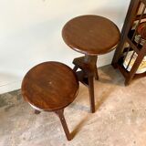 2 tripod stools with dark wood screws