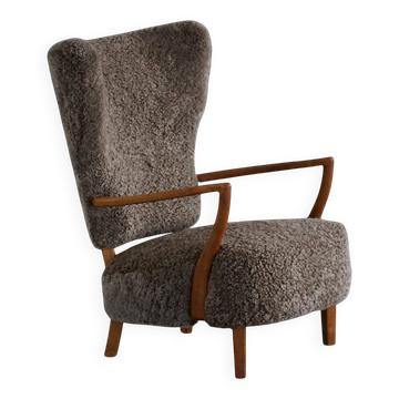 High-backed chaise longue in oak and lambswool, Danish Modern, Viggo Boesen, 1950s.