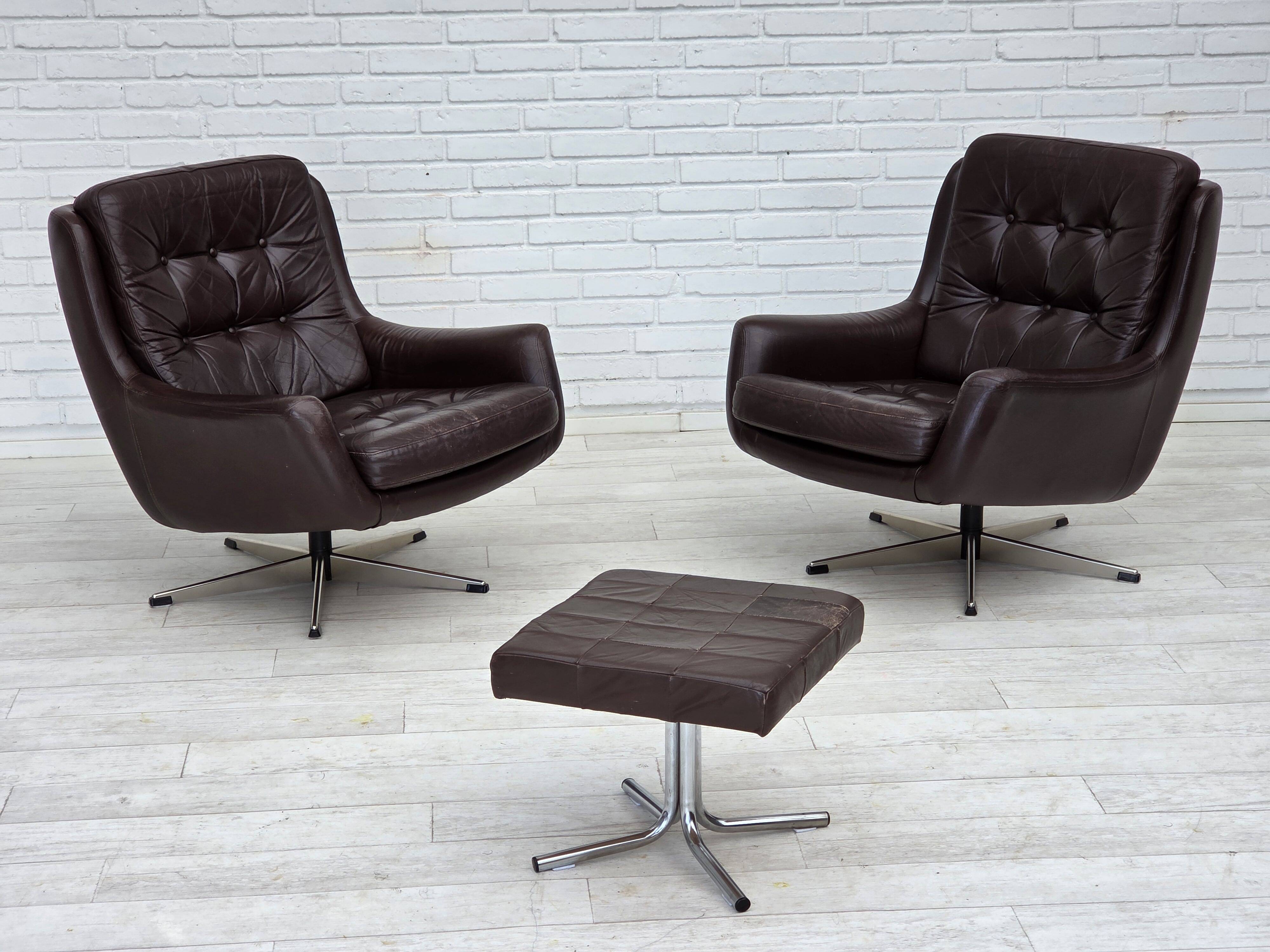 1970s, set of two swivel lounge chairs with footstool, leather.