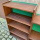Vintage Scandinavian shelf from the 1960s in wood with green velvet.