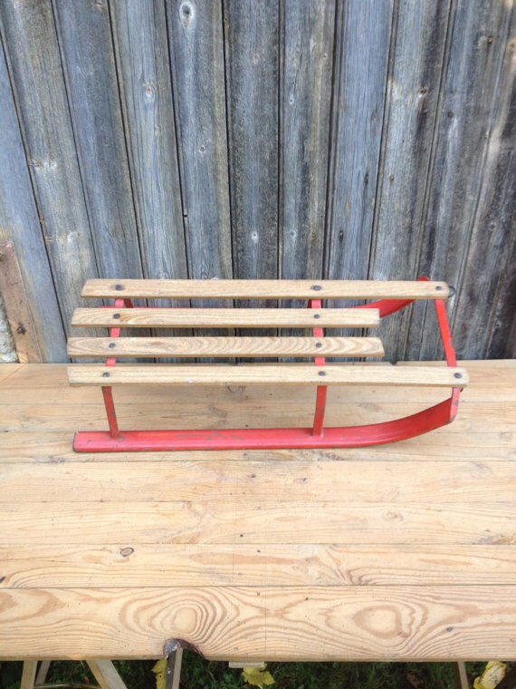 Red sled in metal and wood in the 1960s