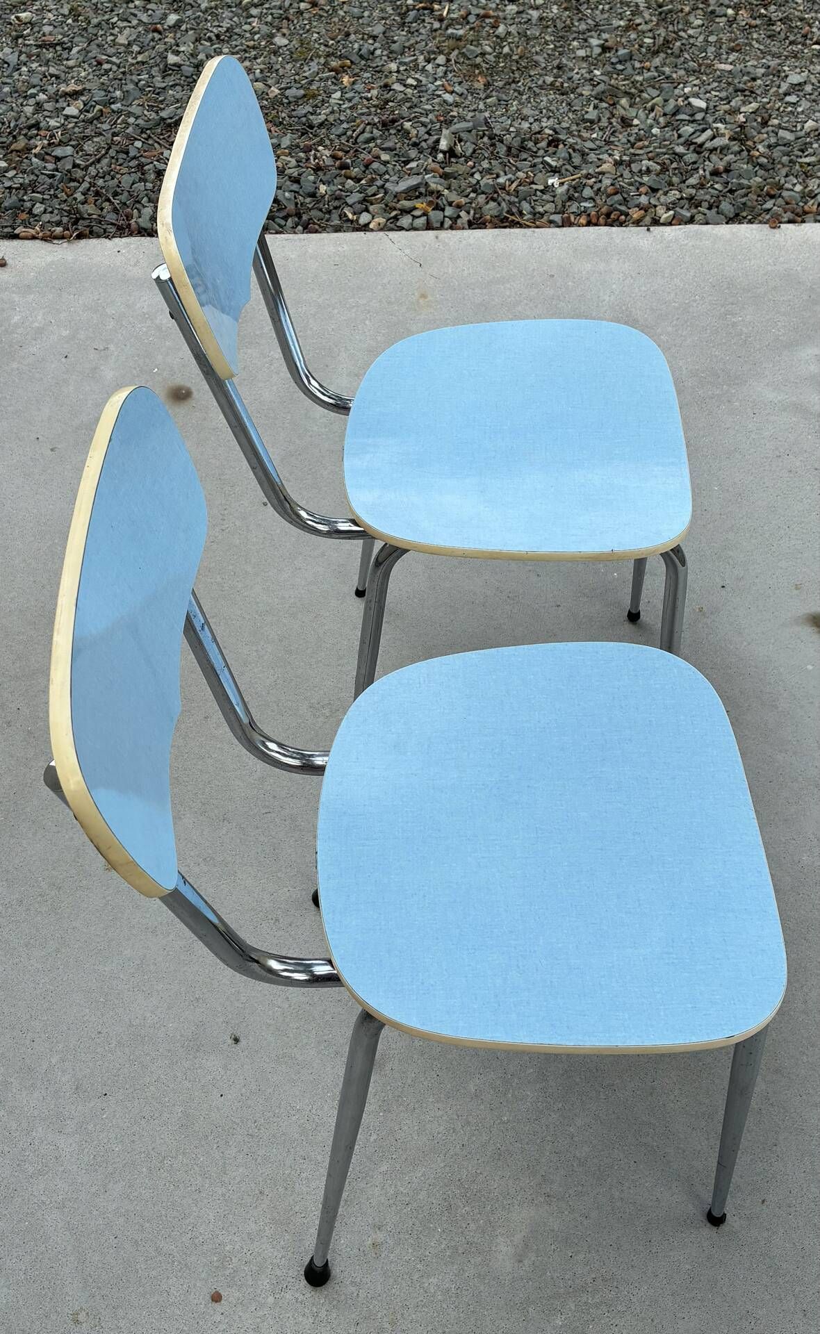 Two blue Formica "Peugeot" chairs.