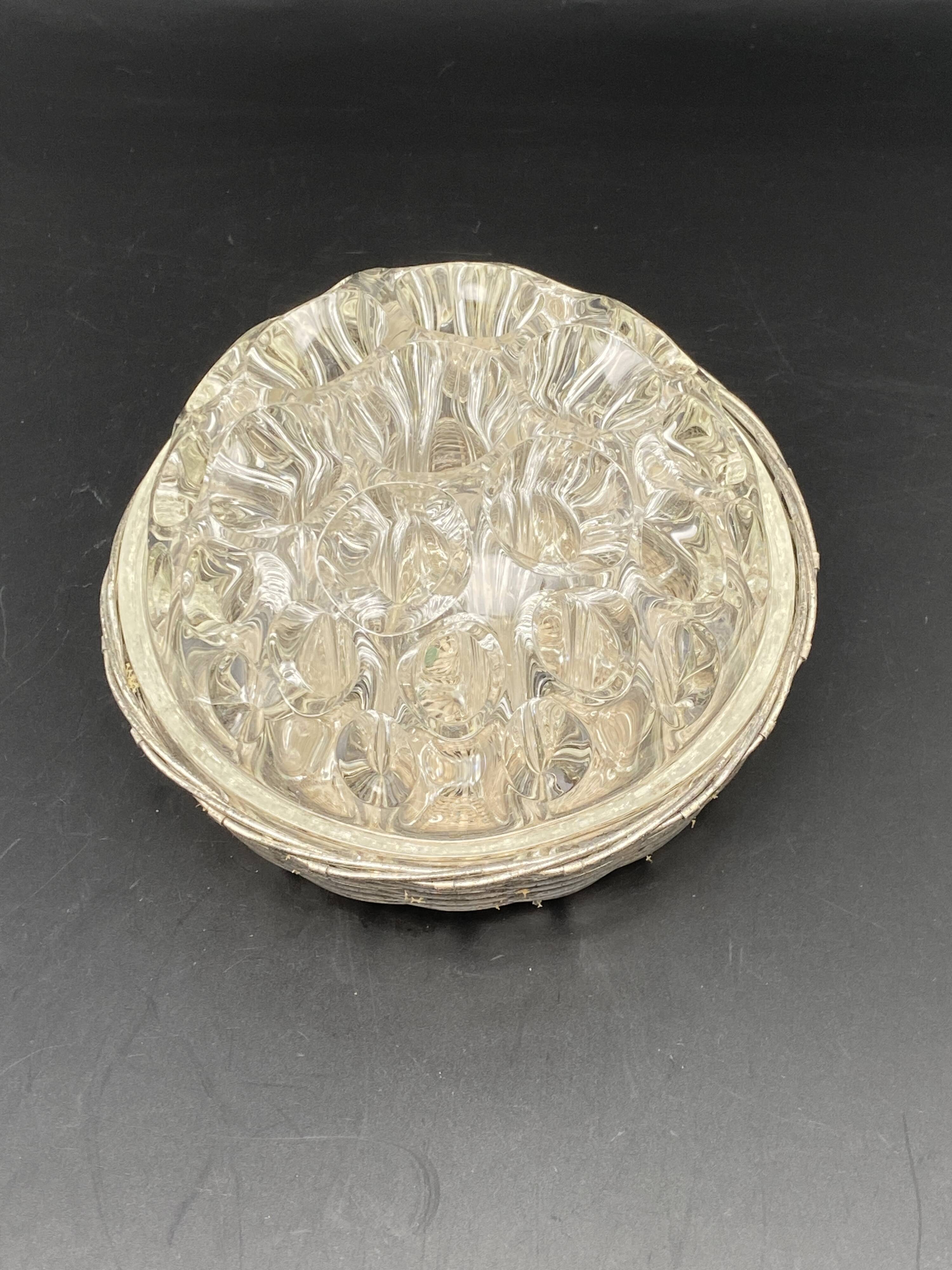 Glass flower stand with woven metal support