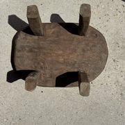 Small stool, oval solid teak side table with curved legs in wabi-sabi style.